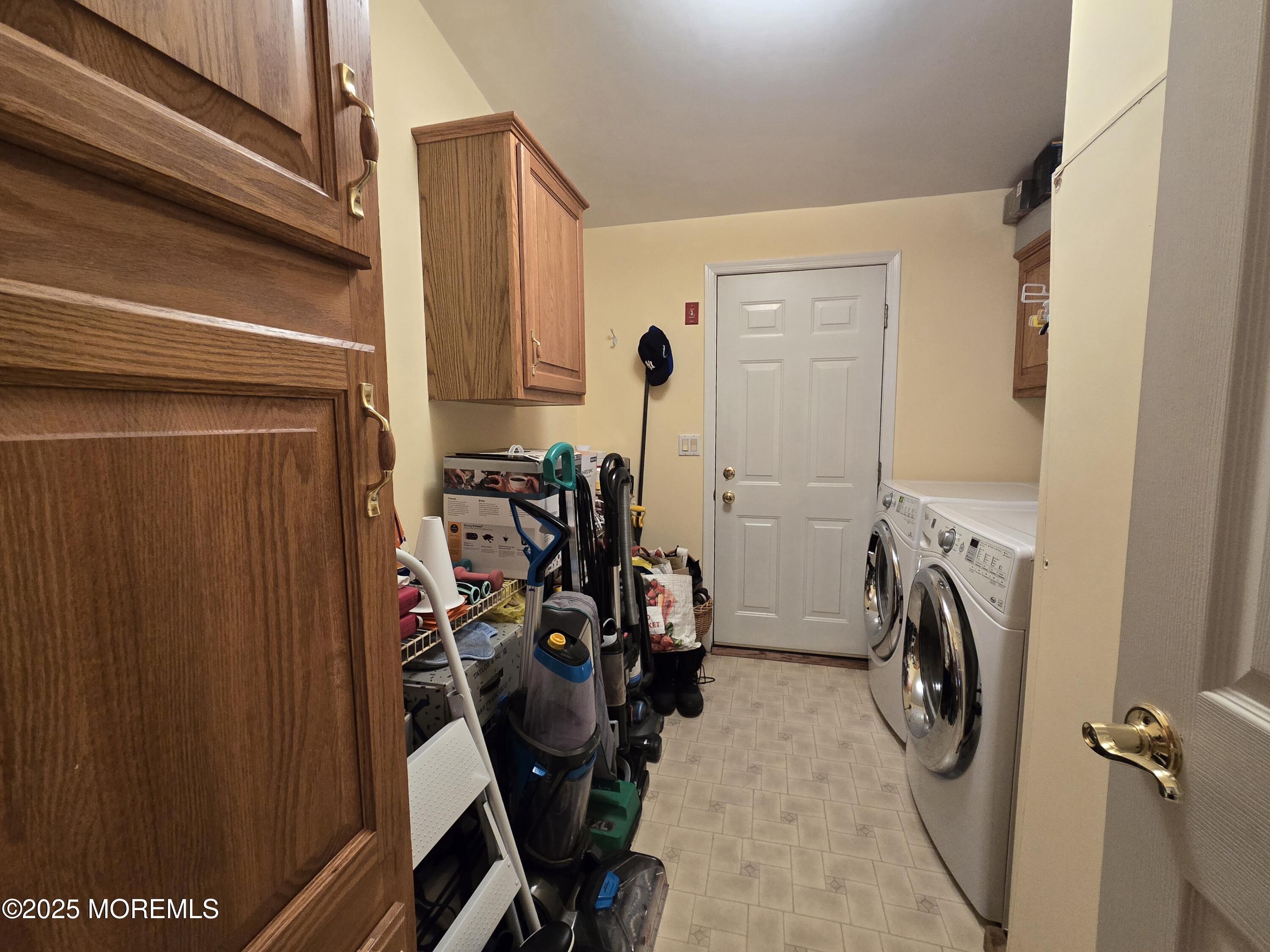 98 Woody Road Freehold, NJ 07728 - Photo 27 of 37 a view of walk in closet with clothes