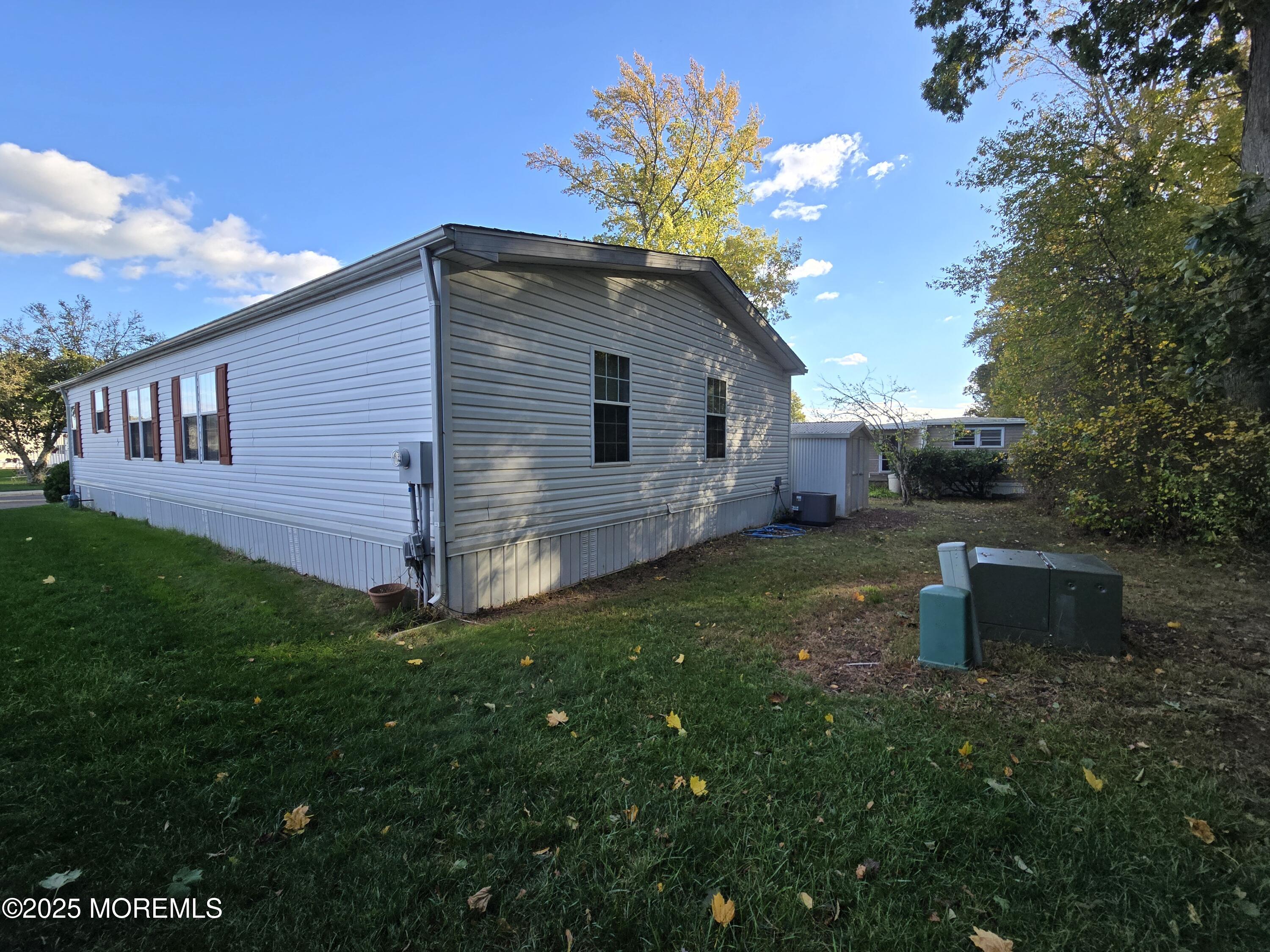 98 Woody Road Freehold, NJ 07728 - Photo 31 of 37 a backyard of a house with lots of green space