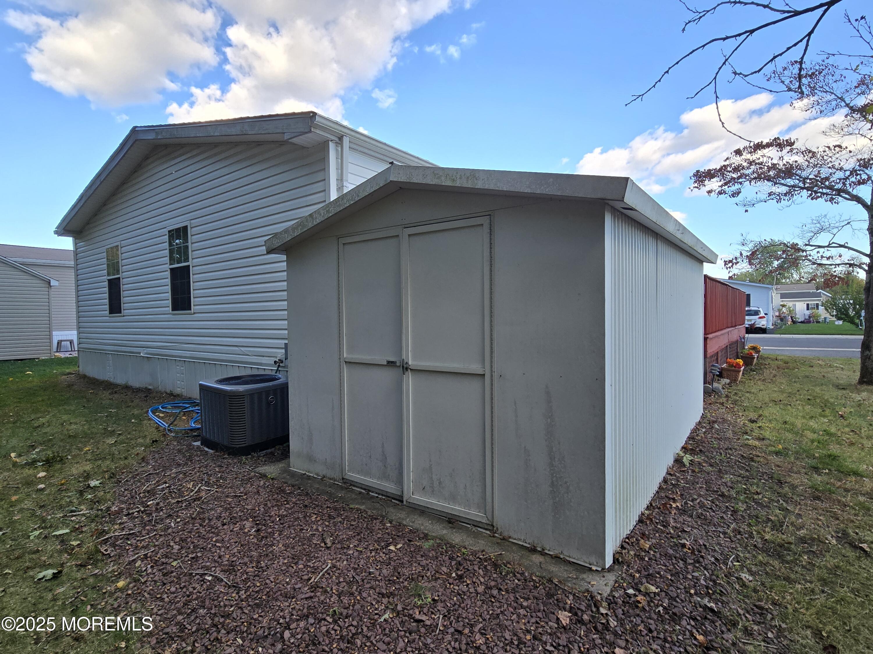 98 Woody Road Freehold, NJ 07728 - Photo 32 of 37 a view of a backyard with potted plants