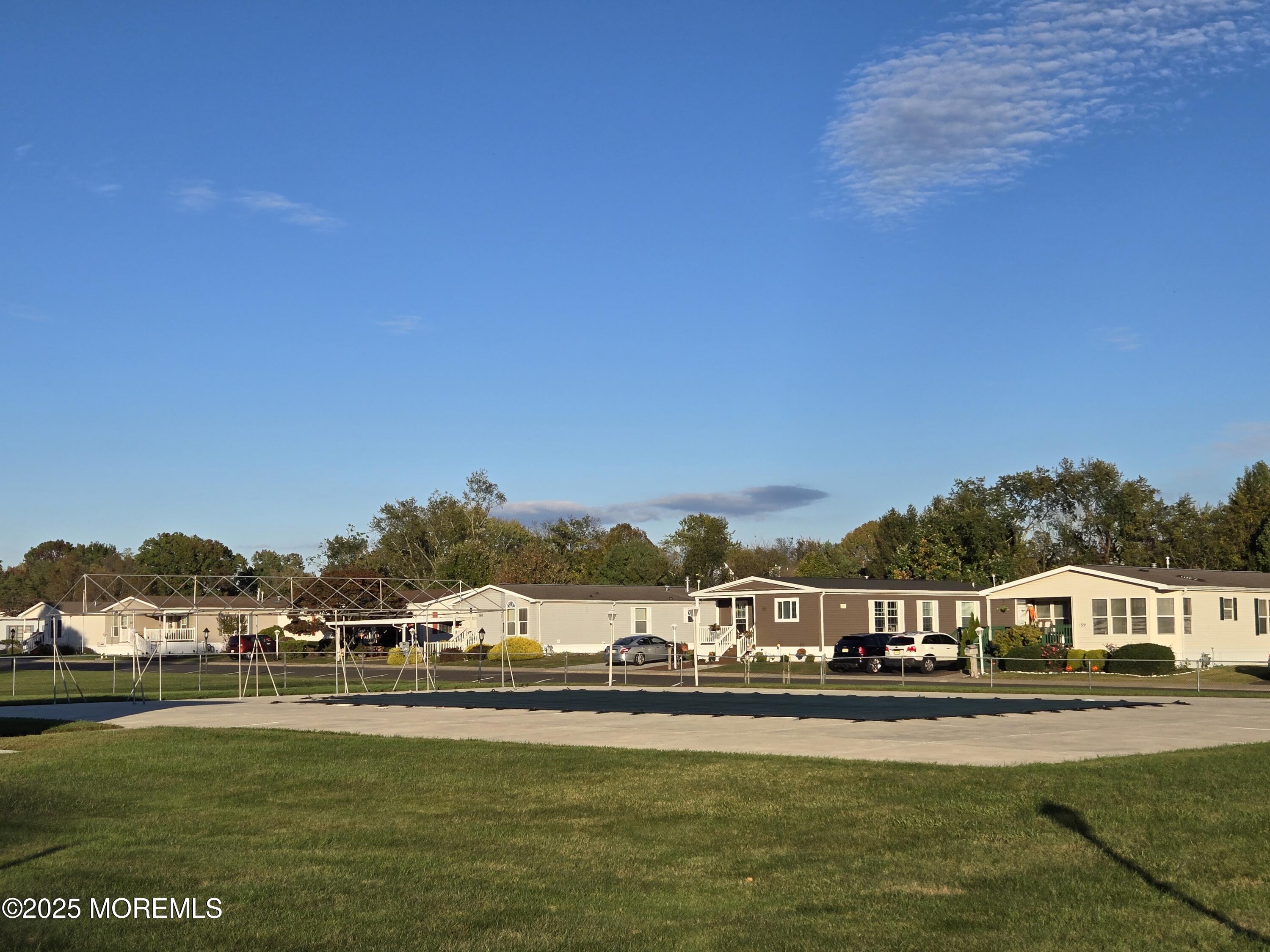 98 Woody Road Freehold, NJ 07728 - Photo 36 of 37 a view of swimming pool and lake view