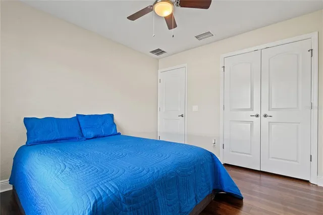 a bed room with a bed and a chandelier