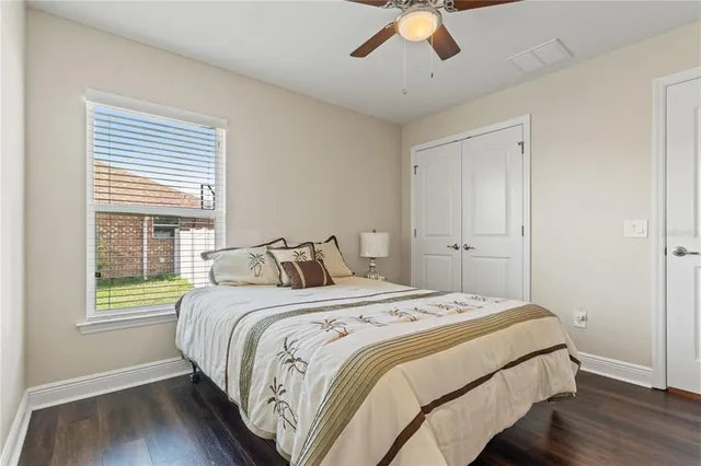 a bedroom with bed and window