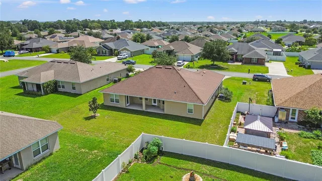 an aerial view of a house with a garden