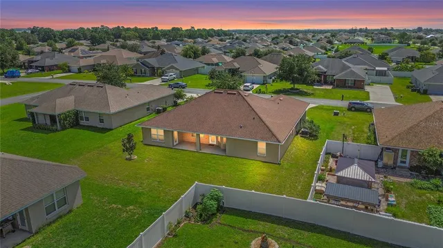 an aerial view of a house with a garden