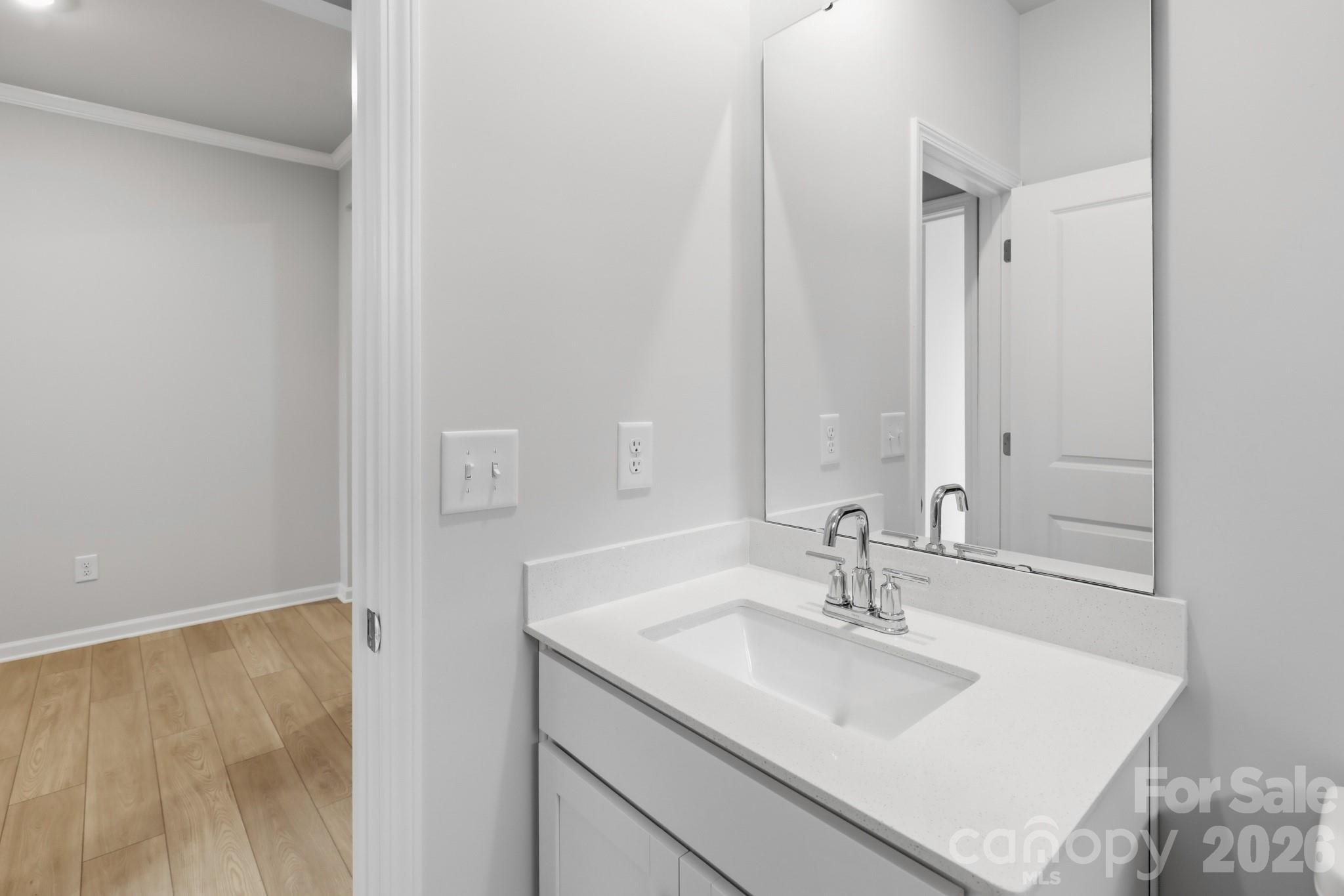 5450 Redbud Road, Unit 66 Lancaster, SC 29720 - Photo 25 of 35 a bathroom with a sink and a mirror