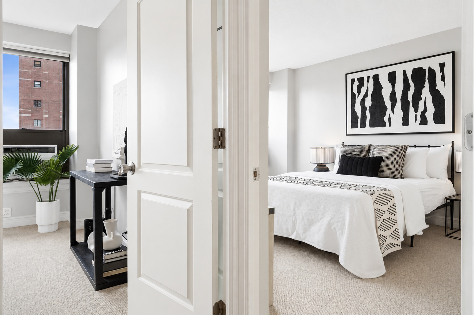 2930 North Sheridan Road, Unit 1301 Chicago, IL 60657 - Photo 12 of 27 a bedroom with a bed and a painting on the wall