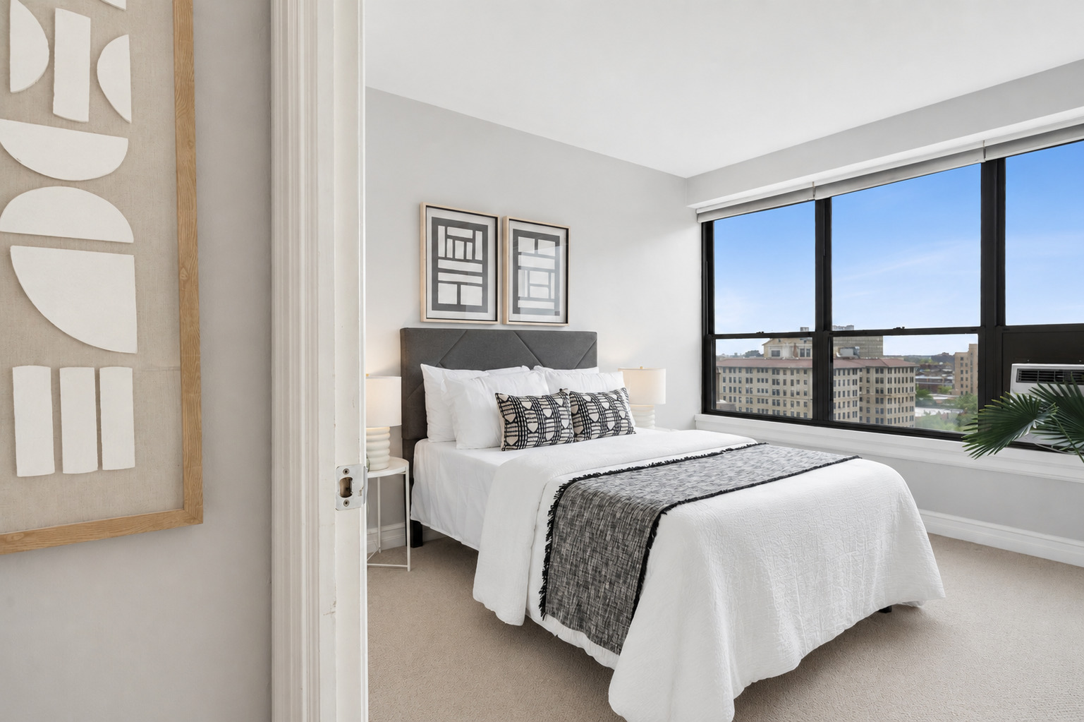 2930 North Sheridan Road, Unit 1301 Chicago, IL 60657 - Photo 17 of 27 a bedroom with a large bed and a window