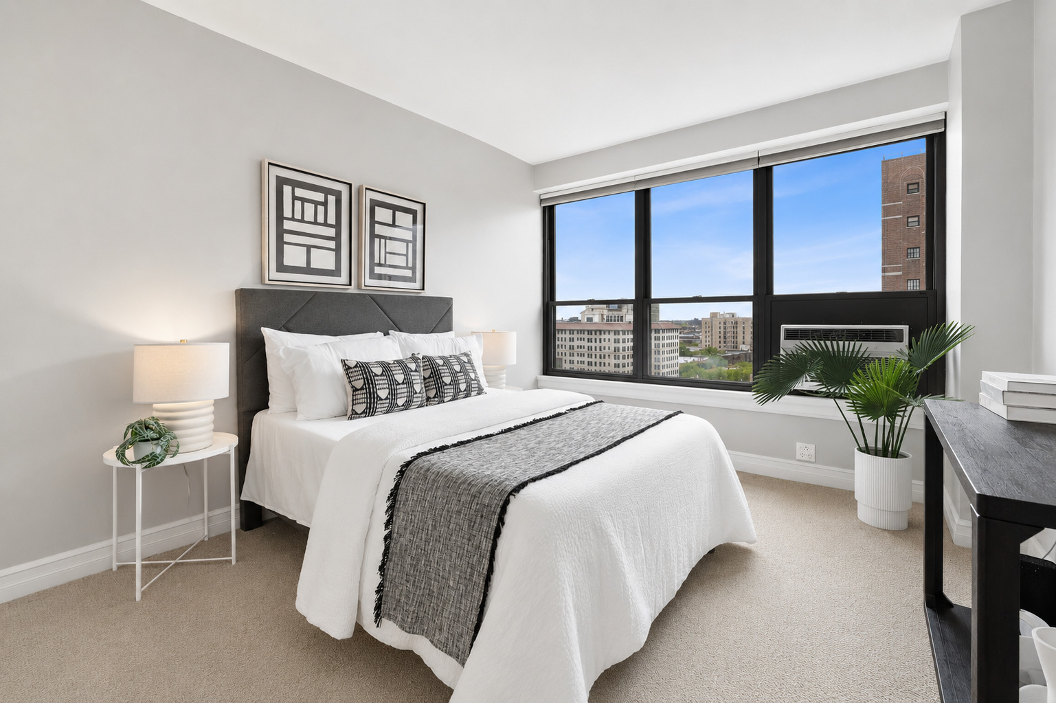 2930 North Sheridan Road, Unit 1301 Chicago, IL 60657 - Photo 18 of 27 a bedroom with a large bed and a large window