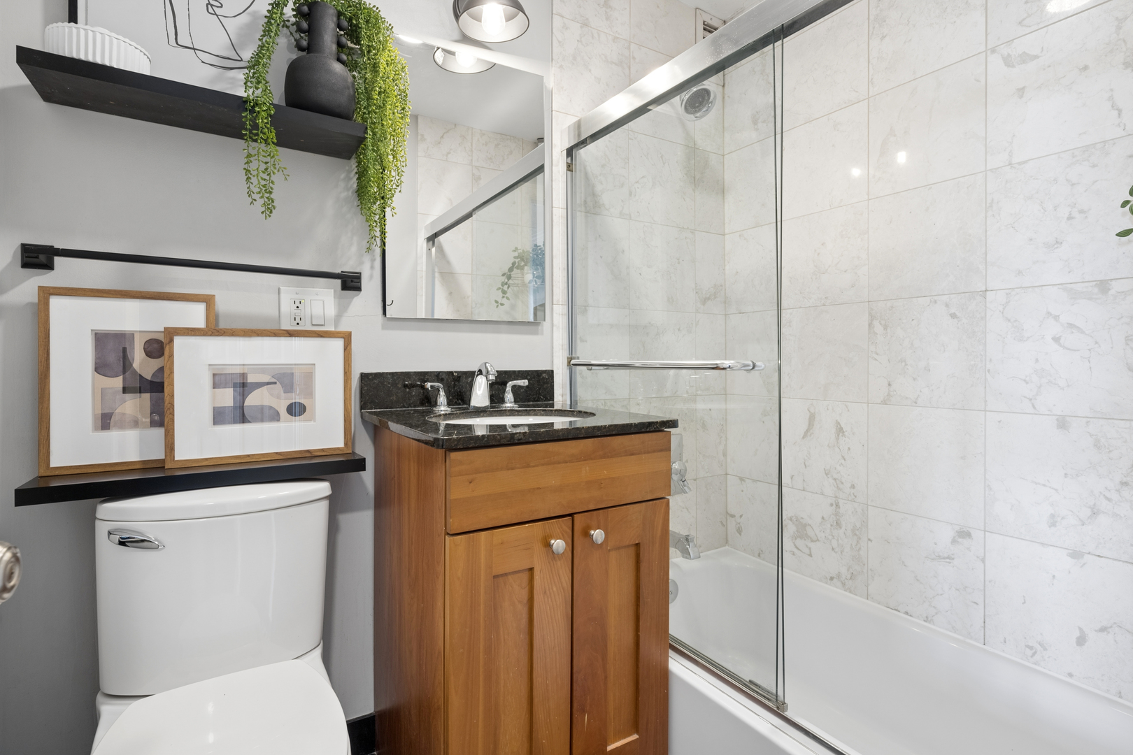 2930 North Sheridan Road, Unit 1301 Chicago, IL 60657 - Photo 20 of 27 a bathroom with a sink a toilet and shower
