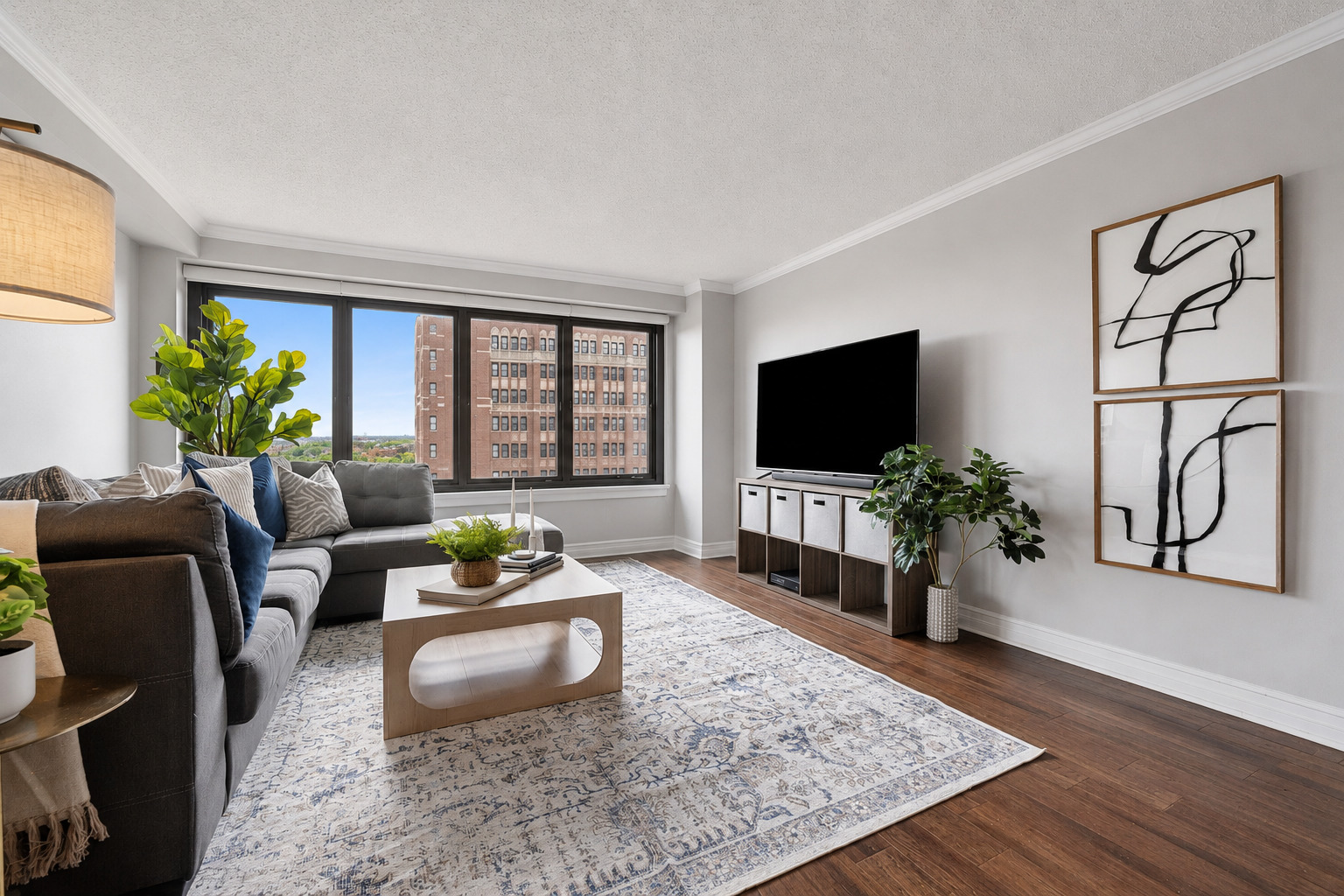 2930 North Sheridan Road, Unit 1301 Chicago, IL 60657 - Photo 5 of 27 a living room with furniture and a flat screen tv