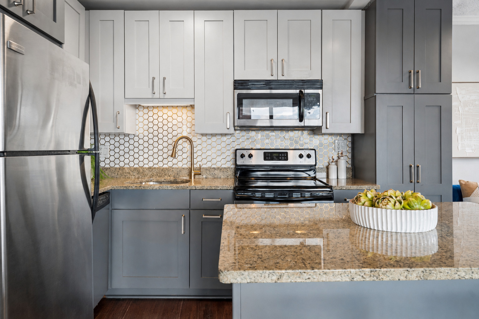2930 North Sheridan Road, Unit 1301 Chicago, IL 60657 - Photo 8 of 27 a kitchen with stainless steel appliances granite countertop a sink stove and refrigerator