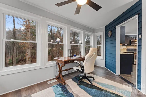 a work room with furniture and windows