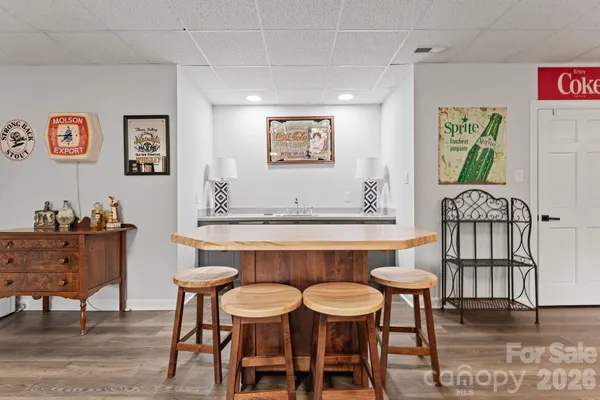 a view of a dining room with furniture and a table