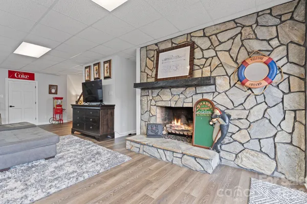 a living room with furniture and a fireplace