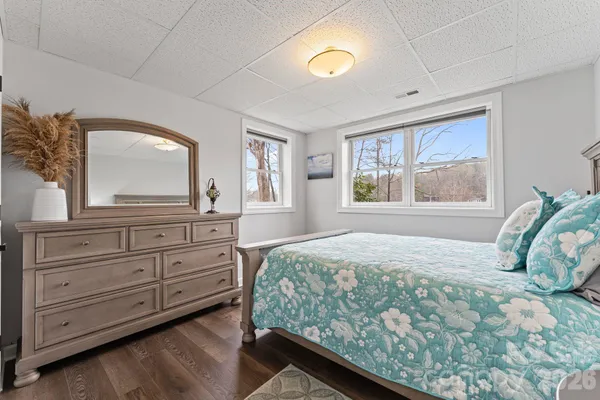 a bedroom with a large bed and a window