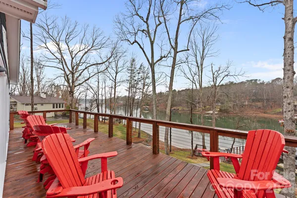 a balcony with wooden floor and outdoor space