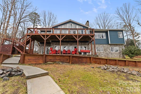 a view of a small house with roof deck