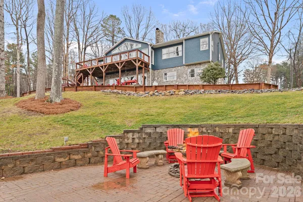 a view of a house with backyard porch and sitting area