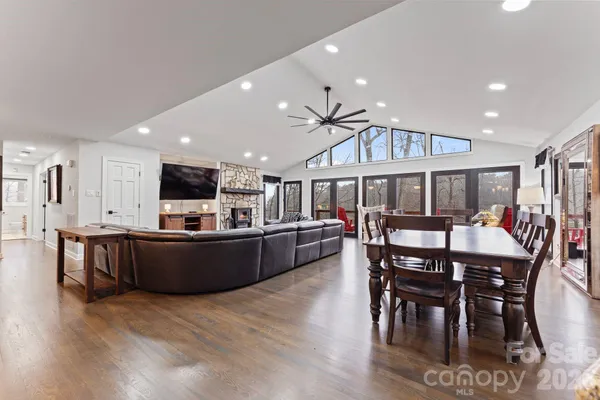 a view of a dining room with furniture kitchen and wooden floor