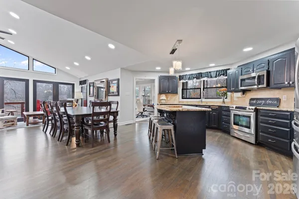 a kitchen with lots of counter top space and stainless steel appliances