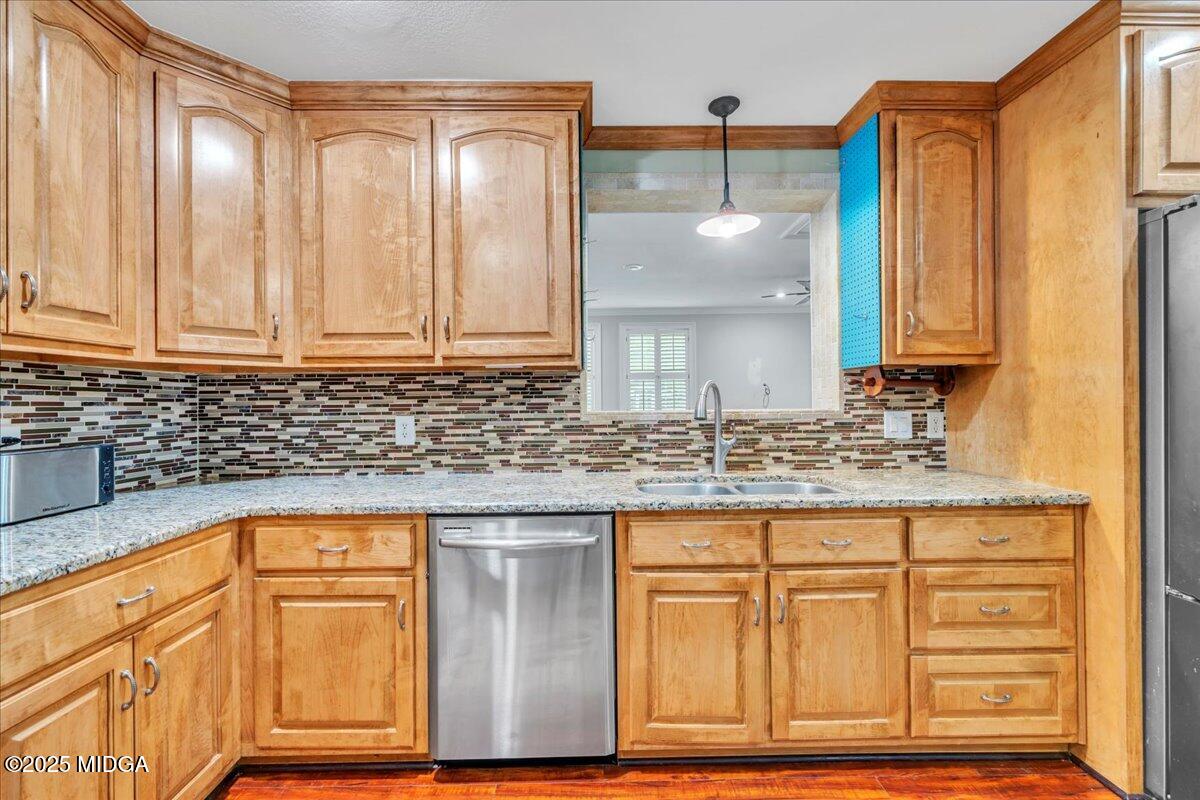354 Pineview Road Gray, GA 31032 - Photo 11 of 44 a kitchen with granite countertop a sink and cabinets