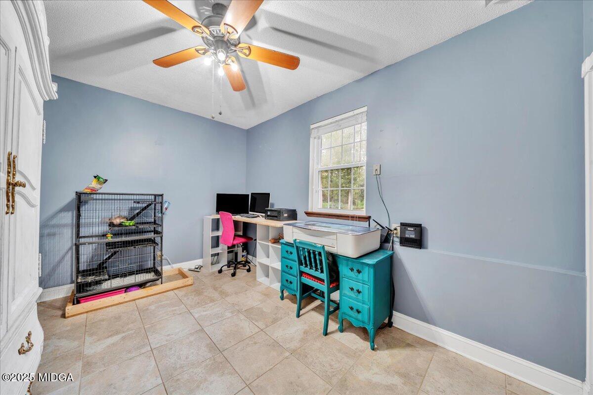 354 Pineview Road Gray, GA 31032 - Photo 17 of 44 a living room with furniture and a dining table