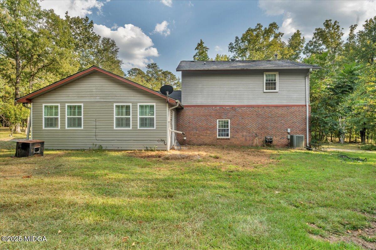 354 Pineview Road Gray, GA 31032 - Photo 34 of 44 a front view of a house with a garden