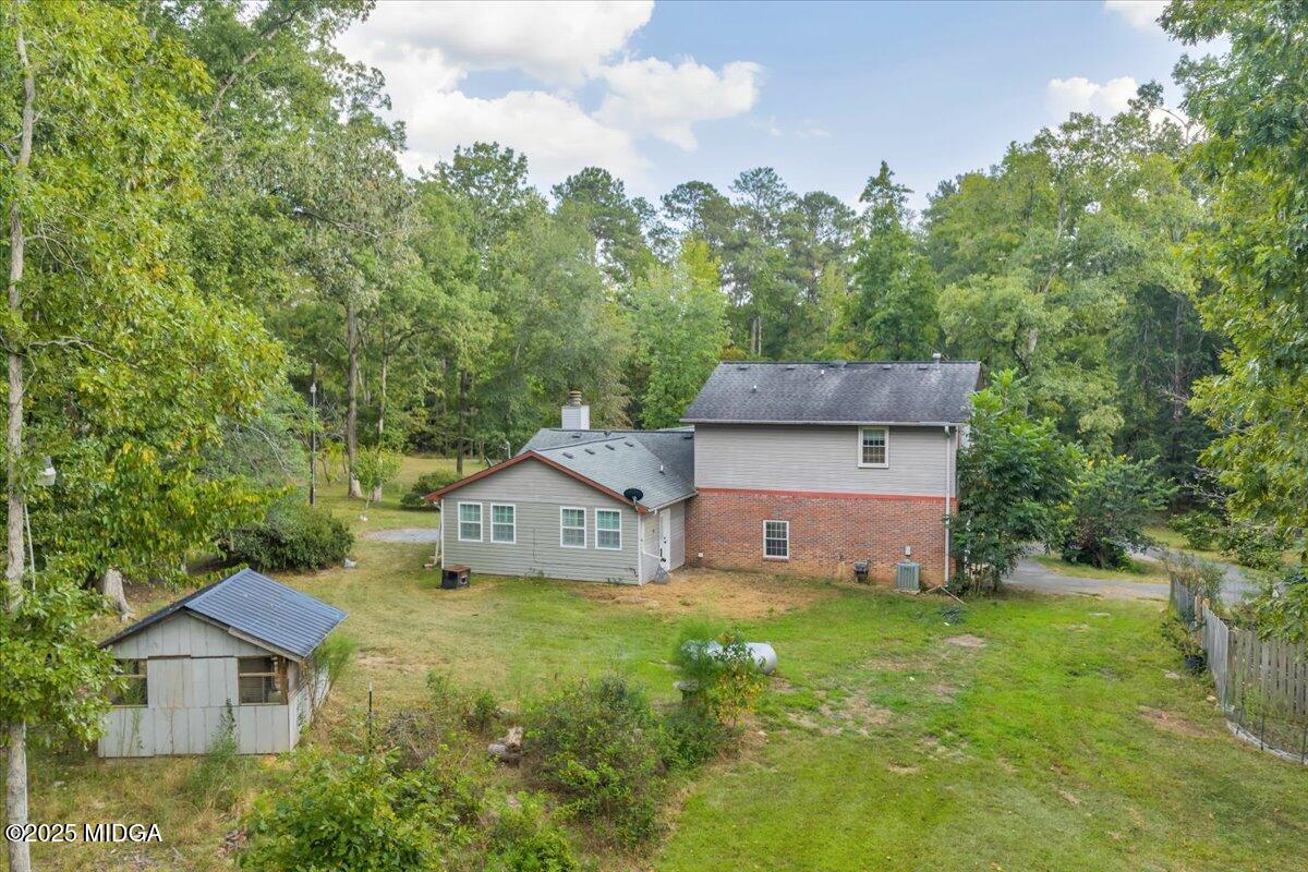 354 Pineview Road Gray, GA 31032 - Photo 35 of 44 a front view of a house with a yard and trees