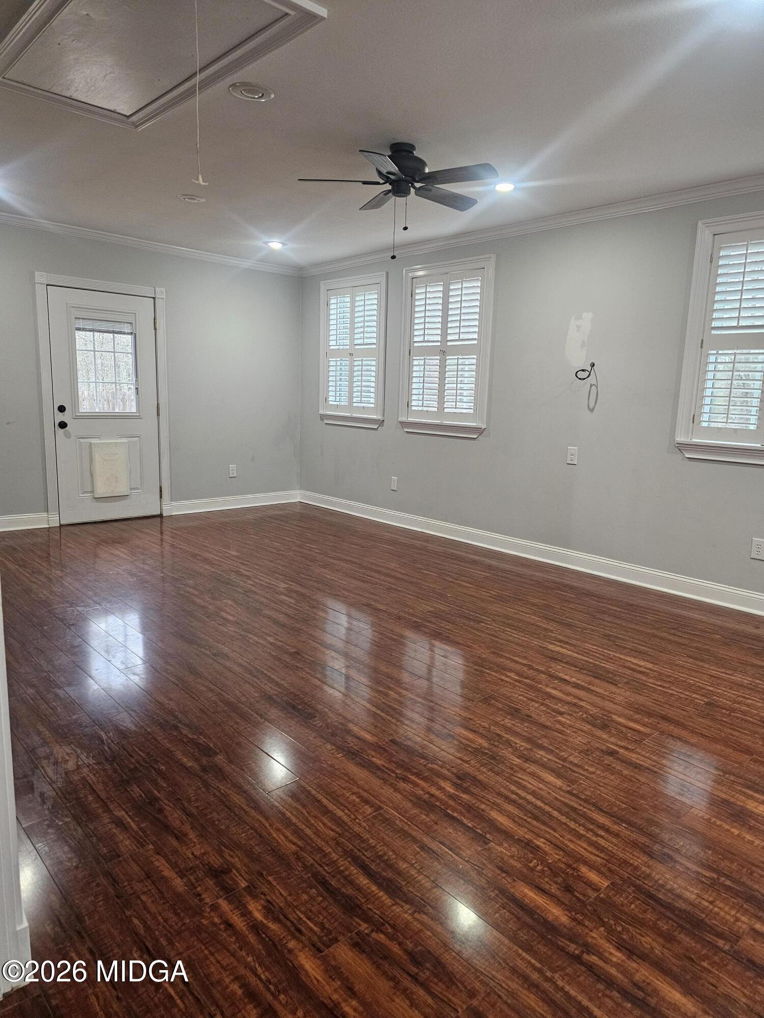 354 Pineview Road Gray, GA 31032 - Photo 43 of 44 a view of an empty room with wooden floor and a window