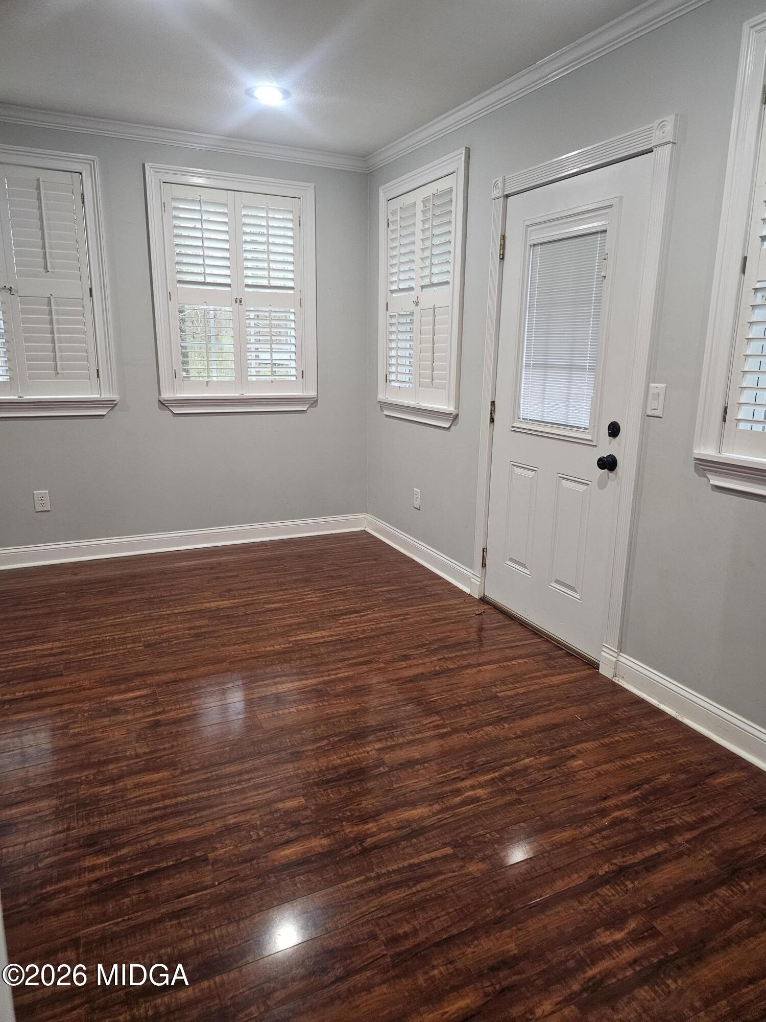 354 Pineview Road Gray, GA 31032 - Photo 44 of 44 an empty room with wooden floor and windows