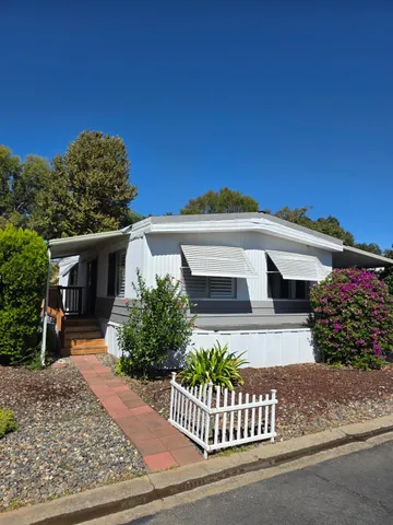 front view of a house with a garden
