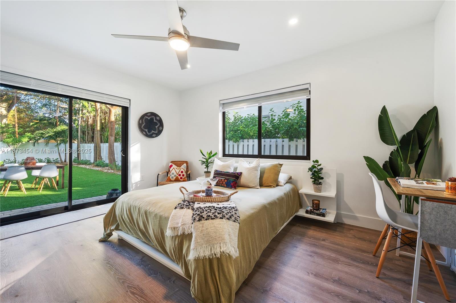 2917 Center Street Miami, FL 33133 - Photo 15 of 32 a bedroom with a bed and a large window