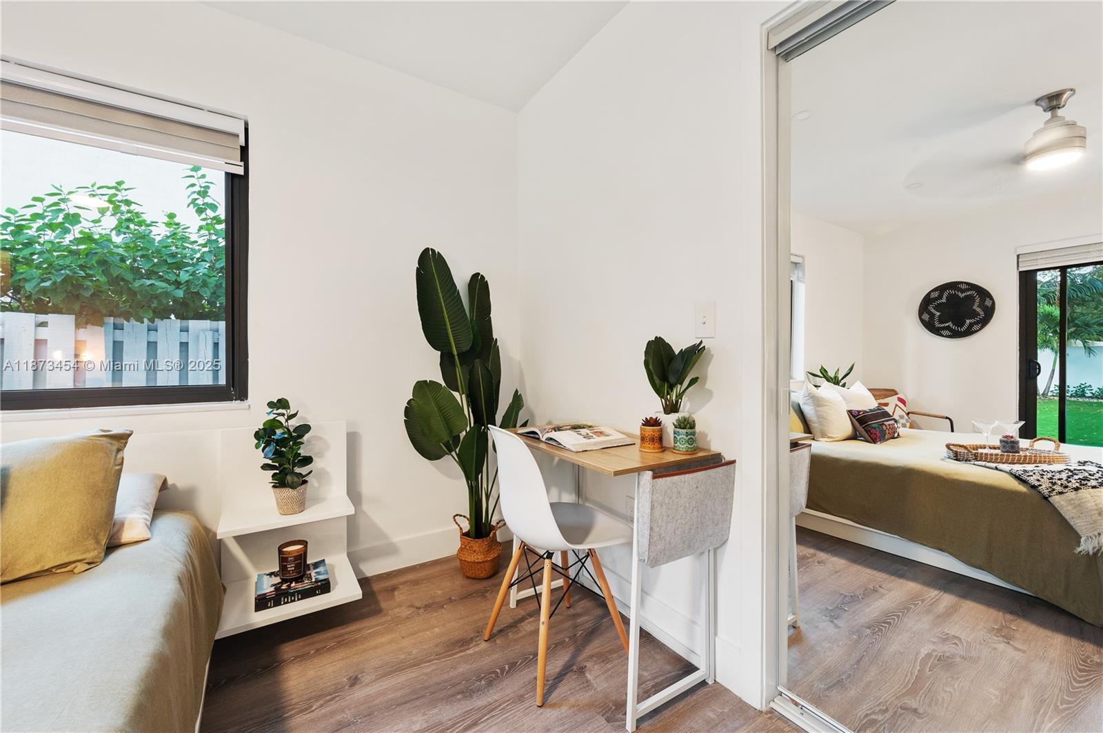 2917 Center Street Miami, FL 33133 - Photo 16 of 32 a living room with furniture and a large window