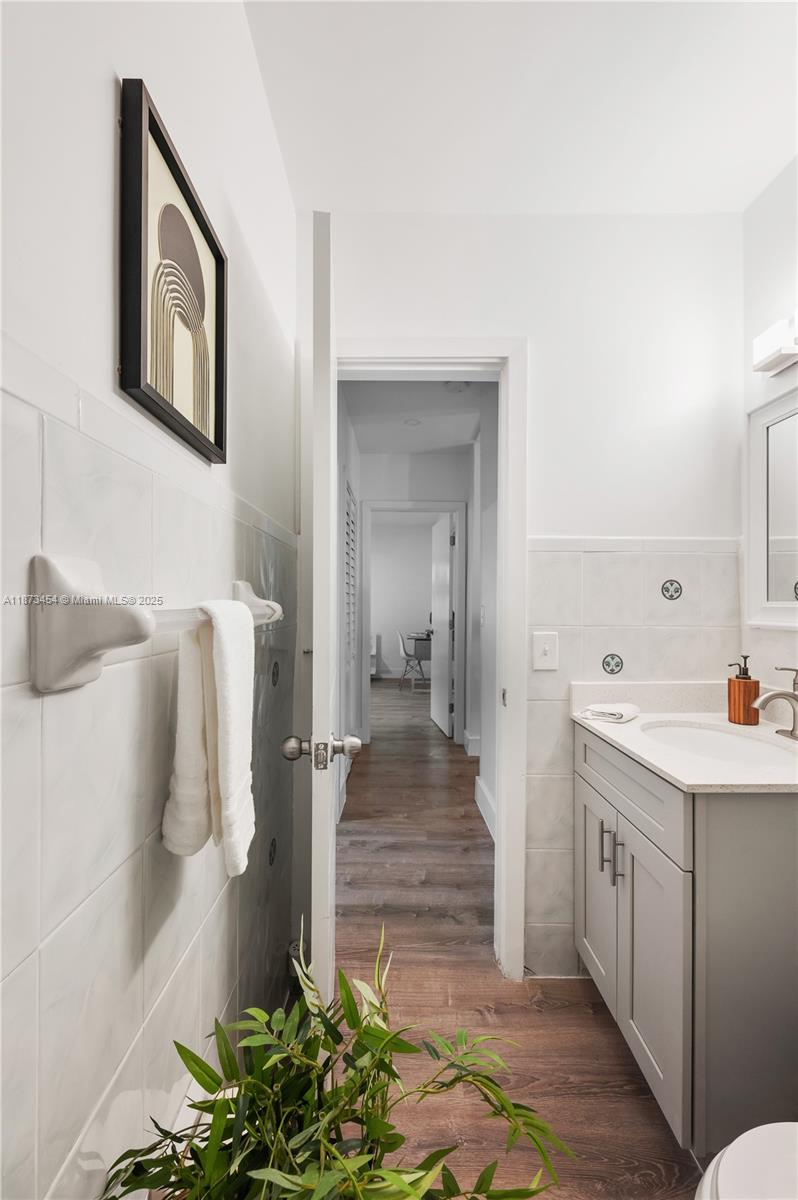 2917 Center Street Miami, FL 33133 - Photo 19 of 32 a kitchen with a sink and refrigerator