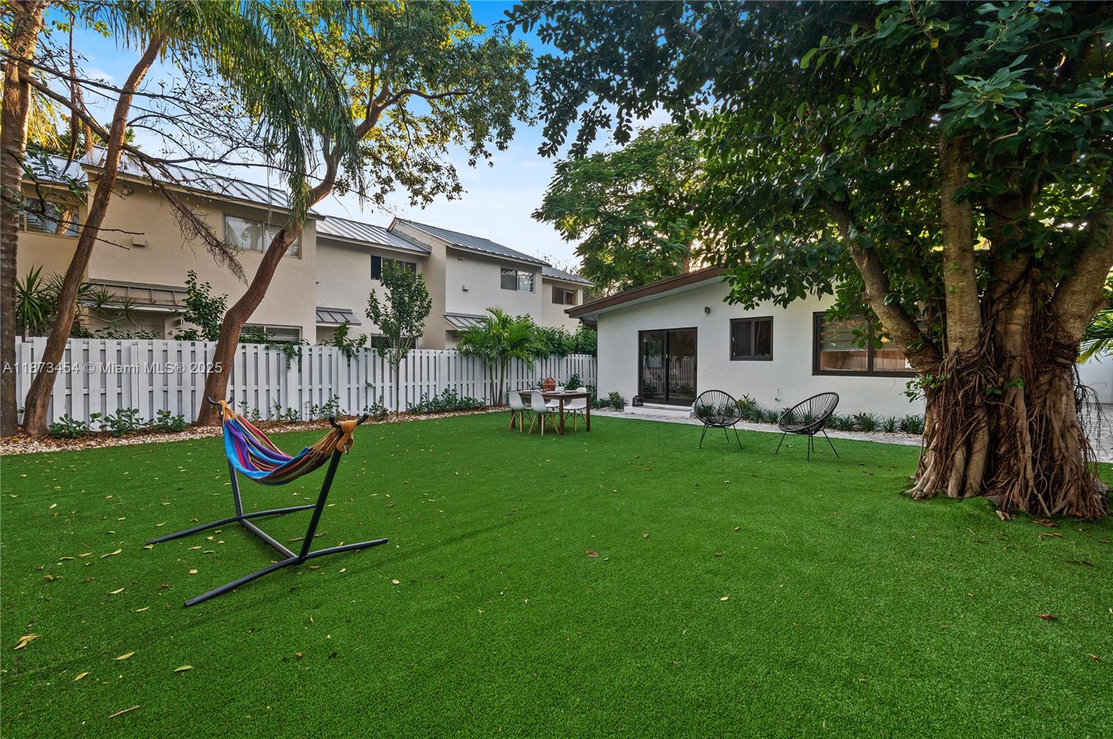 2917 Center Street Miami, FL 33133 - Photo 25 of 32 a house view with a garden space