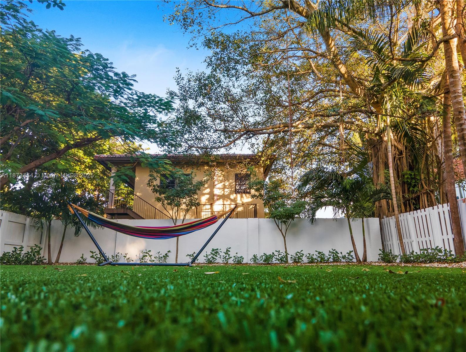 2917 Center Street Miami, FL 33133 - Photo 26 of 32 a view of backyard with large trees and plants