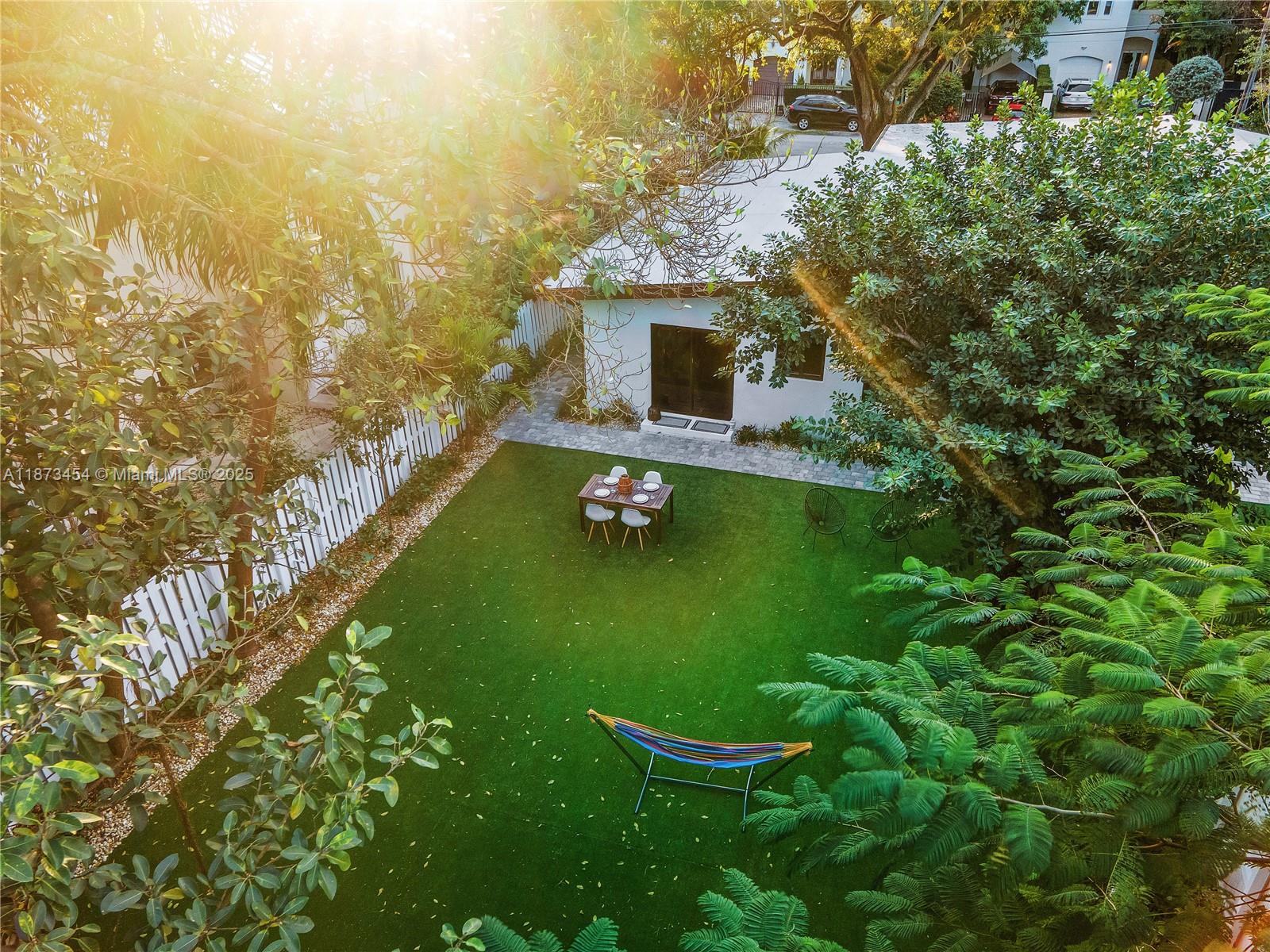 2917 Center Street Miami, FL 33133 - Photo 27 of 32 a view of a lake with a garden