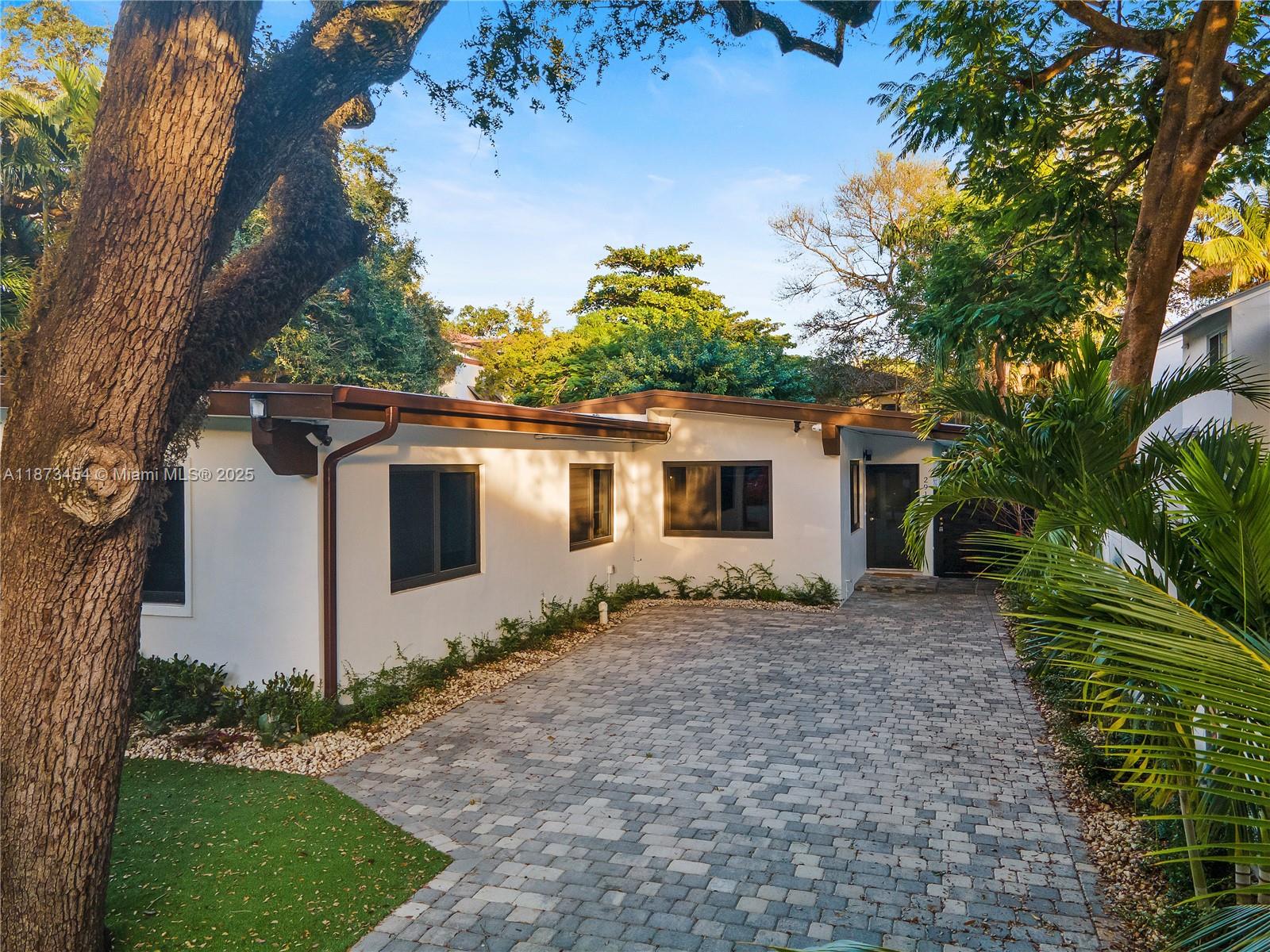 2917 Center Street Miami, FL 33133 - Photo 30 of 32 a view of a house with a yard