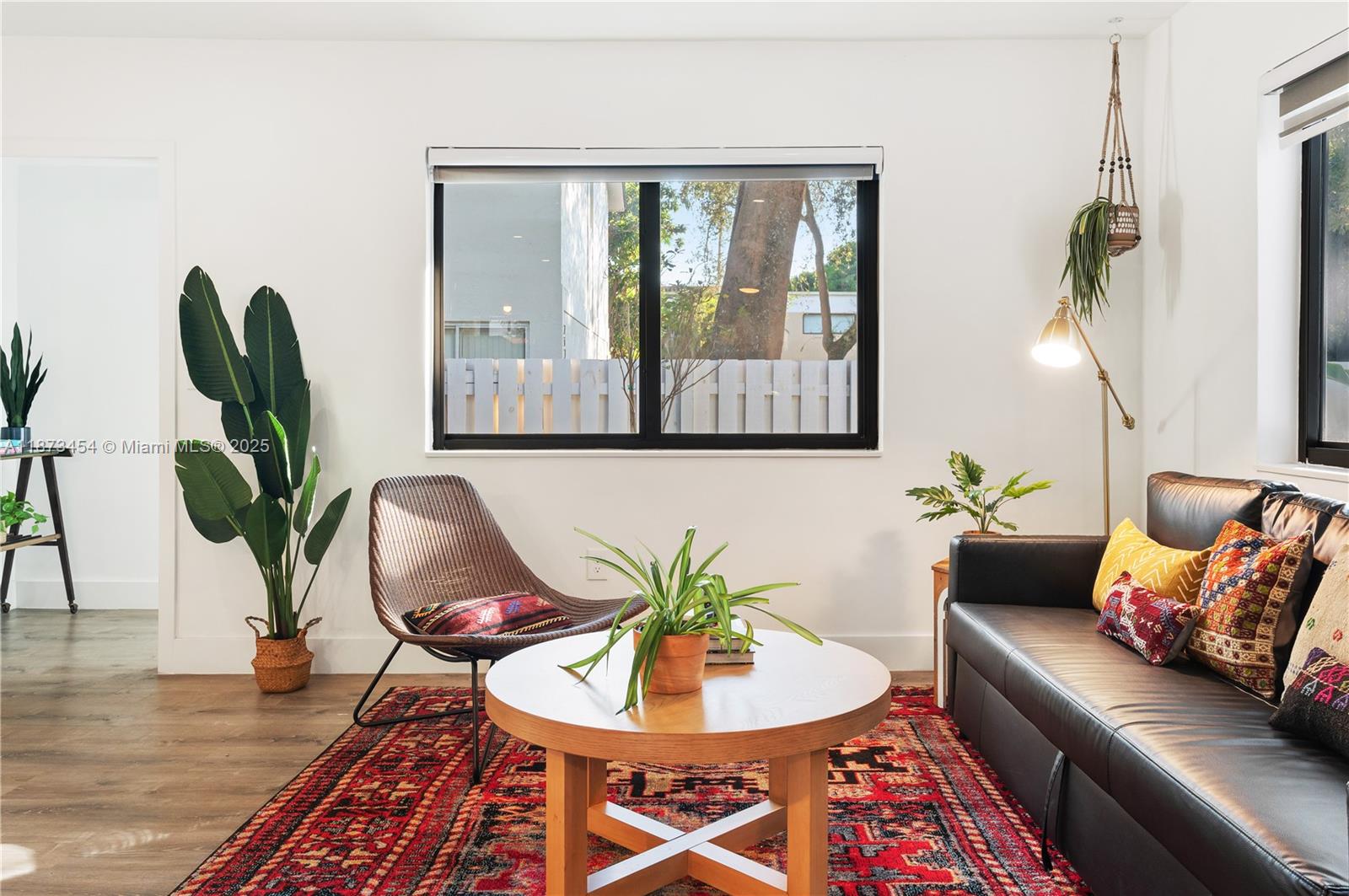 2917 Center Street Miami, FL 33133 - Photo 3 of 32 a living room with furniture and a potted plant