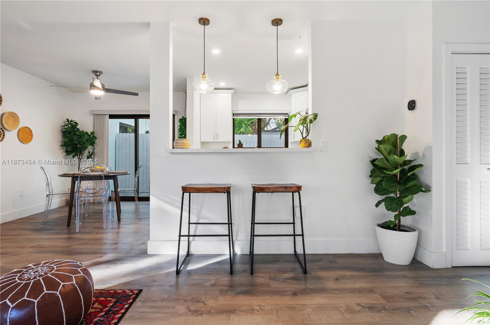 2917 Center Street Miami, FL 33133 - Photo 9 of 32 a view of a dining room with furniture and wooden floor