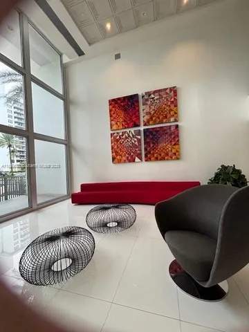 a living room with furniture and a window