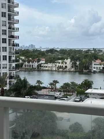 an aerial view of a city with houses with lake view