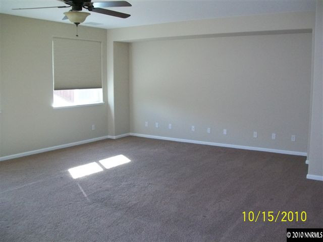 460 Teramo Court Reno, NV 89521 - Photo 3 of 13 a view of an empty room and a window