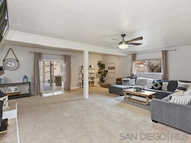 6460 Rainbow Heights Road Fallbrook, CA 92028 - Photo 16 of 38 a living room with furniture and a large window