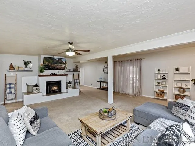6460 Rainbow Heights Road Fallbrook, CA 92028 - Photo 17 of 38 a living room with furniture and a fireplace