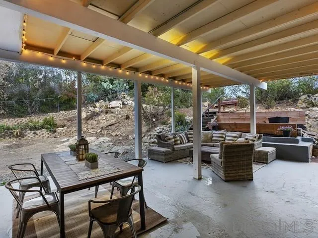 6460 Rainbow Heights Road Fallbrook, CA 92028 - Photo 27 of 38 a view of a patio with a table chairs and a grill