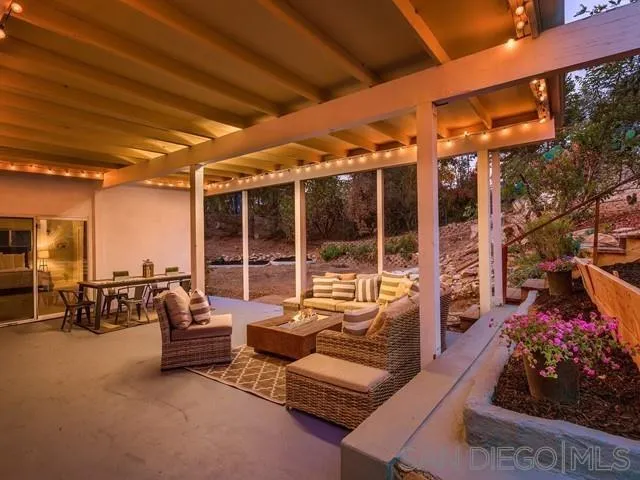 6460 Rainbow Heights Road Fallbrook, CA 92028 - Photo 3 of 38 a building outdoor space with patio furniture and potted plants