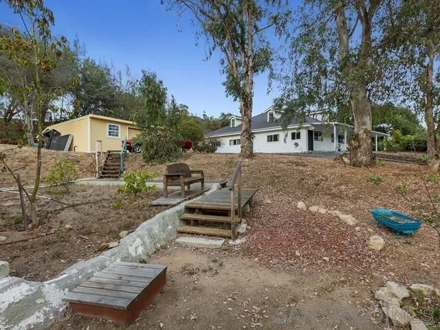 6460 Rainbow Heights Road Fallbrook, CA 92028 - Photo 34 of 38 a view of a house with a yard