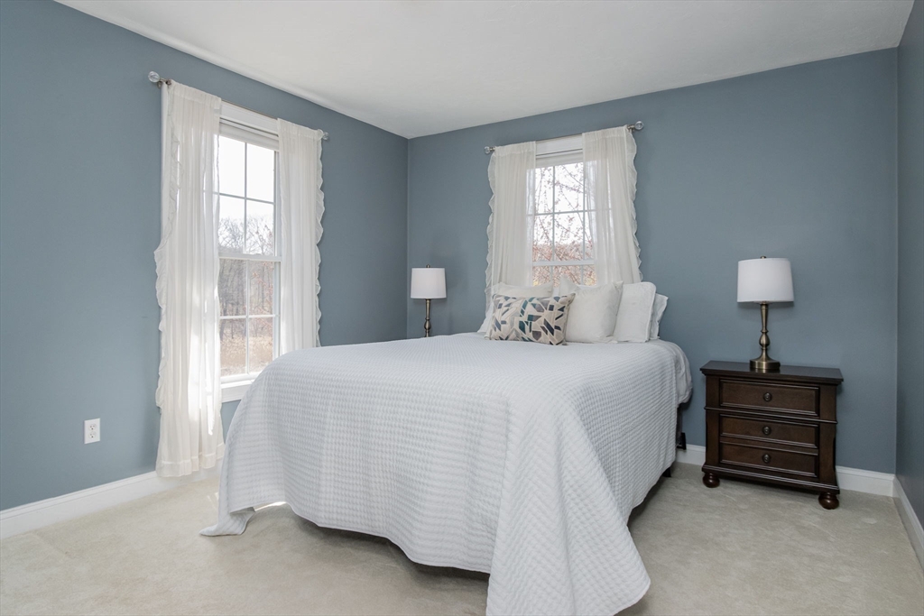 256 Lowell Road Groton, MA 01450 - Photo 26 of 40 a bedroom with a bed and a window