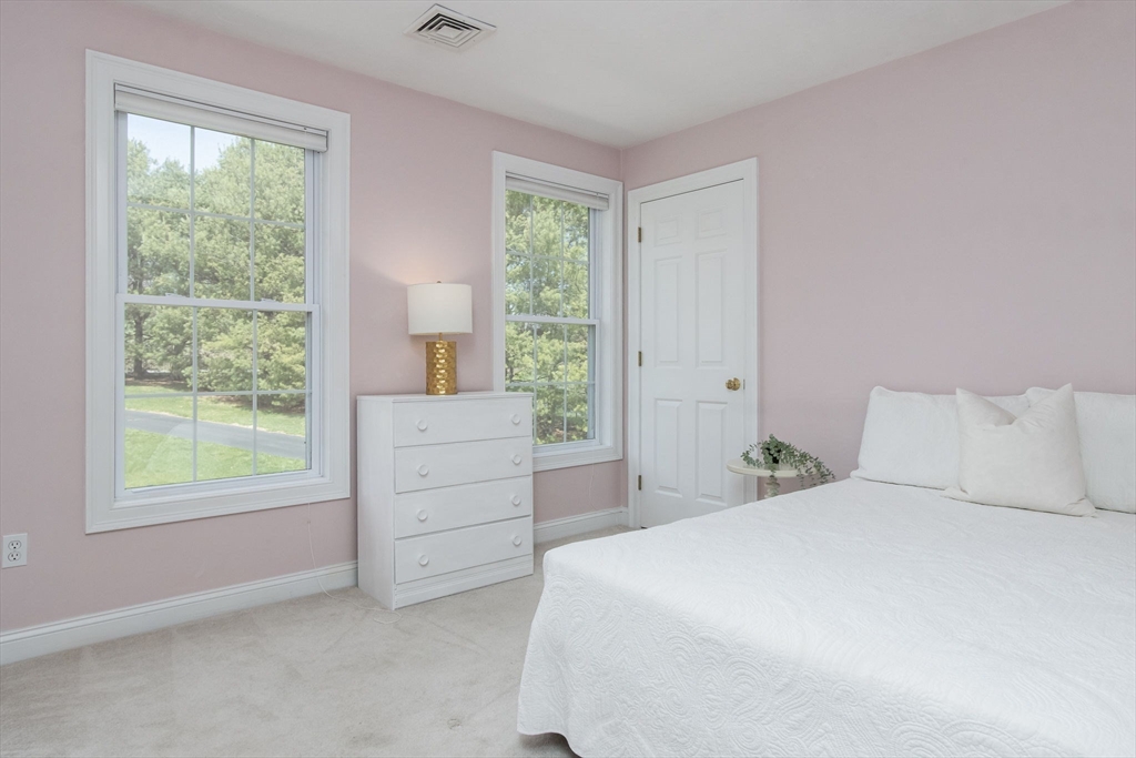 256 Lowell Road Groton, MA 01450 - Photo 28 of 40 a bedroom with a bed and a window